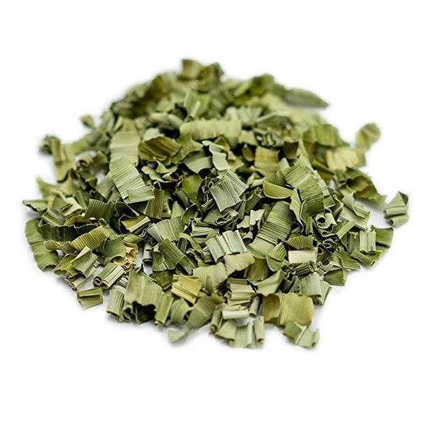 Pile of dried green lemongrass leaves isolated on white background for herbal tea or cooking