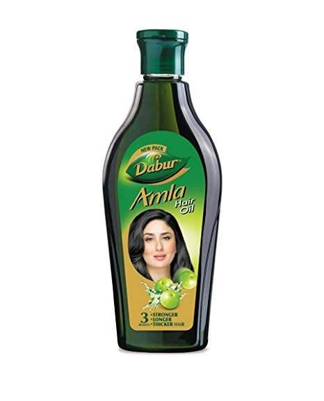 Dabur Amla Hair Oil bottle with green cap, featuring a woman's face and amla fruit on label
