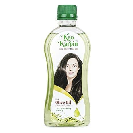 Keo Karpin non-sticky hair oil bottle with olive oil for deep moisturizing therapy