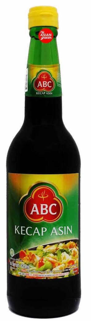 Bottle of ABC Kecap Asin Indonesian salty soy sauce with yellow cap and green label