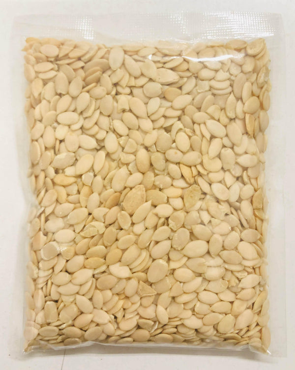 Vacuum-sealed clear plastic bag filled with light-colored melon seeds