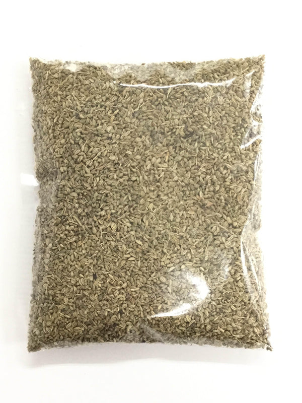 Clear plastic bag filled with small brownish dried seeds, isolated on white background