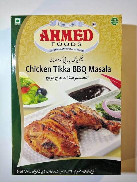 Ahmed Foods Chicken Tikka BBQ Masala spice mix box with grilled chicken leg and dipping sauce