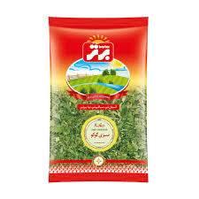 Packaged fresh dried dill herb in a clear plastic bag with red and yellow label