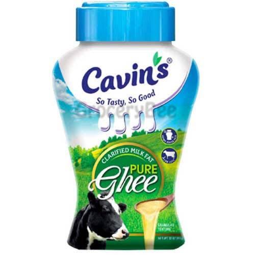 Cavin's clarified milk fat pure ghee bottle with cow and green pasture background