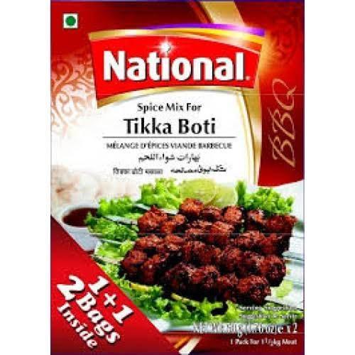 National Tikka Boti barbecue spice mix pack with grilled meat skewers on lettuce