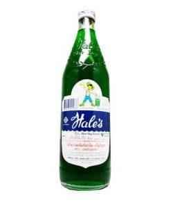 Vintage green glass bottle of Hale's Original Honey Creme Soda with blue and white label