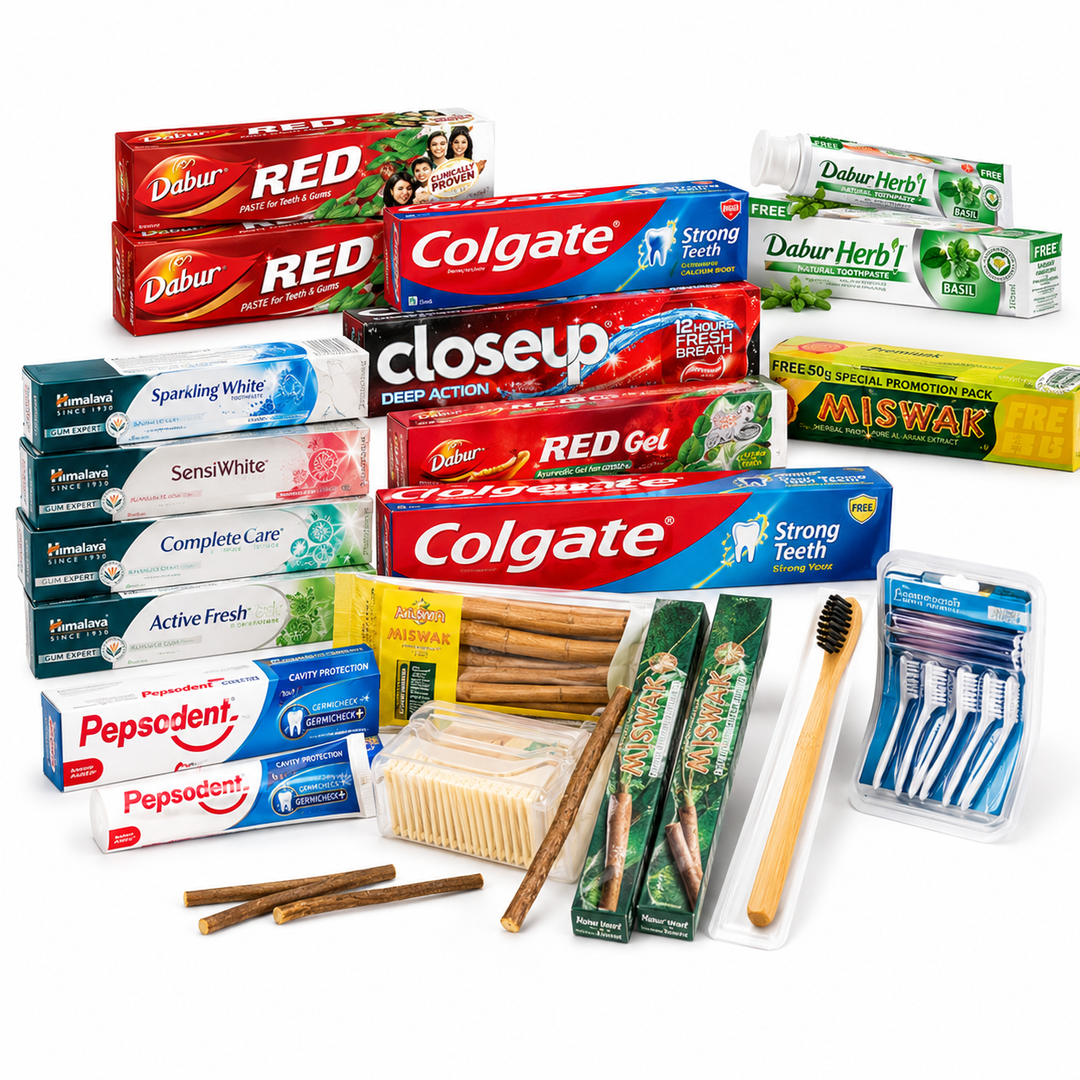 Oral care collection featuring Colgate, Dabur Red, Himalaya, Pepsodent, Miswak toothpaste, toothbrushes and dental care products at AL MODINA Japan