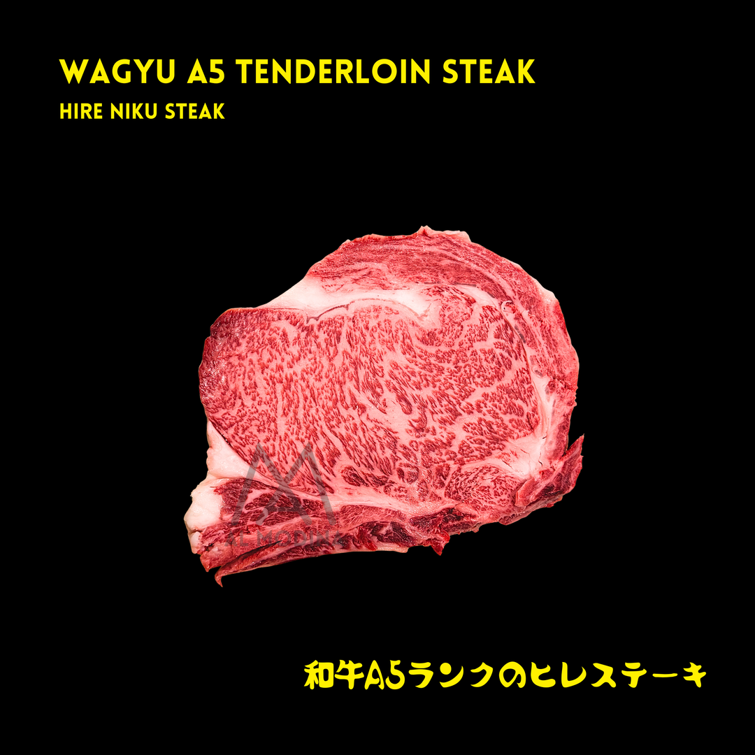 A raw Wagyu A5 tenderloin steak with marbled fat, shown on a solid black background with yellow text reading 'WAGYU A5 TENDERLOIN STEAK' and 'HIRE NIKU STEAK' at the top, and Japanese text at the bottom.
