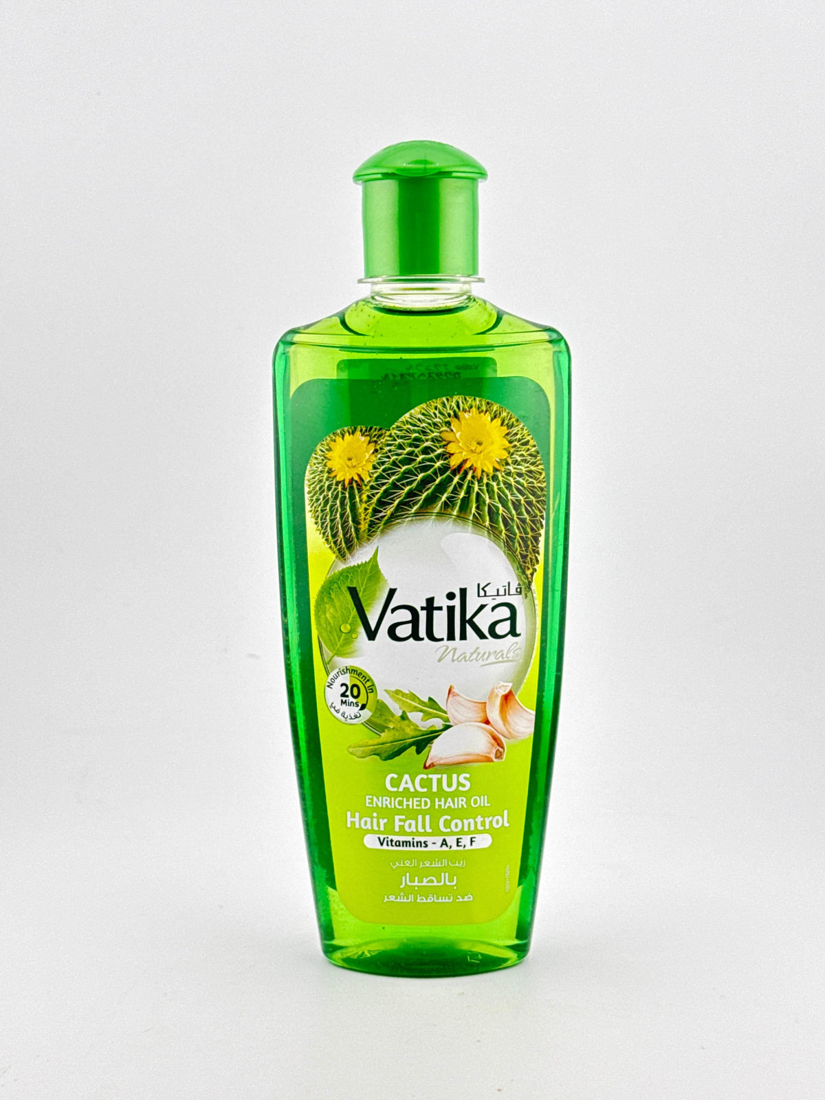 Green bottle of Vatika Cactus enriched hair oil for hair fall control with vitamins A, E, F