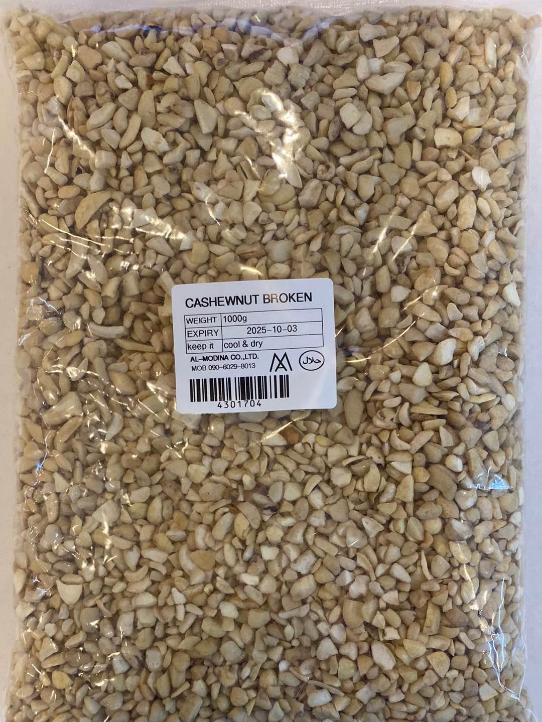 1kg pack of broken cashew nuts in clear plastic bag with label showing expiry date and storage instructions