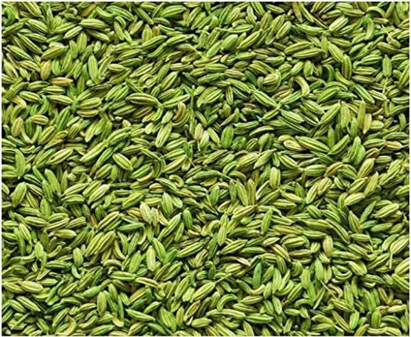 Close-up of fresh green fennel seeds densely packed, showing detailed texture and color