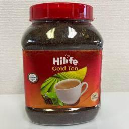 Hilife Gold Tea jar with red lid featuring a cup of tea and tea leaves on the label