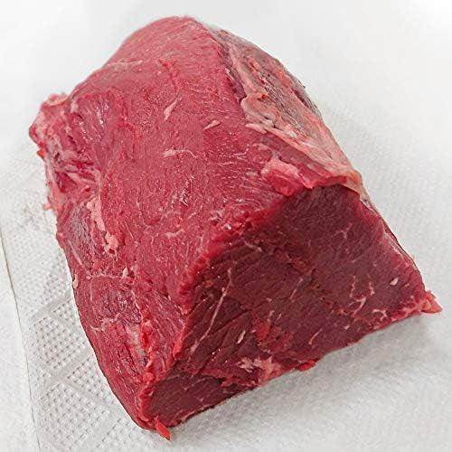 Raw beef steak cut resting on a white paper towel, showcasing fresh red meat texture