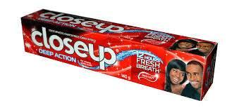 Closeup Deep Action toothpaste box with fresh breath claim and smiling man and woman