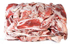 Frozen mutton fat slabs with visible red meat and white fat layers stacked on white background