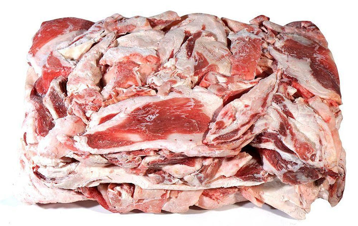 Frozen mutton fat slabs with visible red meat and white fat layers stacked on white background