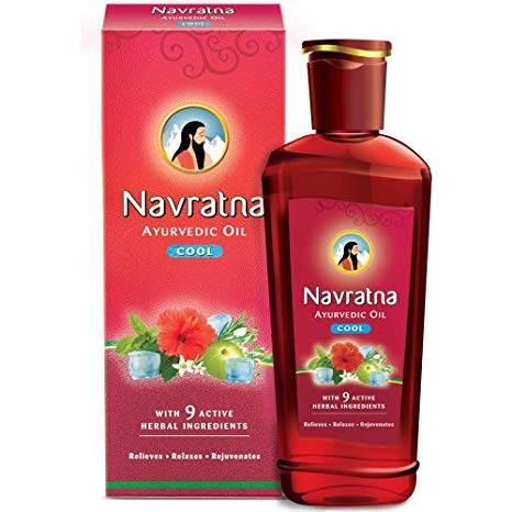 Navratna Ayurvedic Oil Cool with 9 herbal ingredients in red bottle and box packaging
