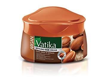 Vatika Argan Styling Hair Cream for exotic shine and softness in brown container with argan nut visuals