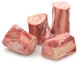 Four pieces of raw beef marrow bones for bulalo stew on white background