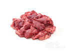 Raw beef cheeks meat pile with visible marbling and fat on white background