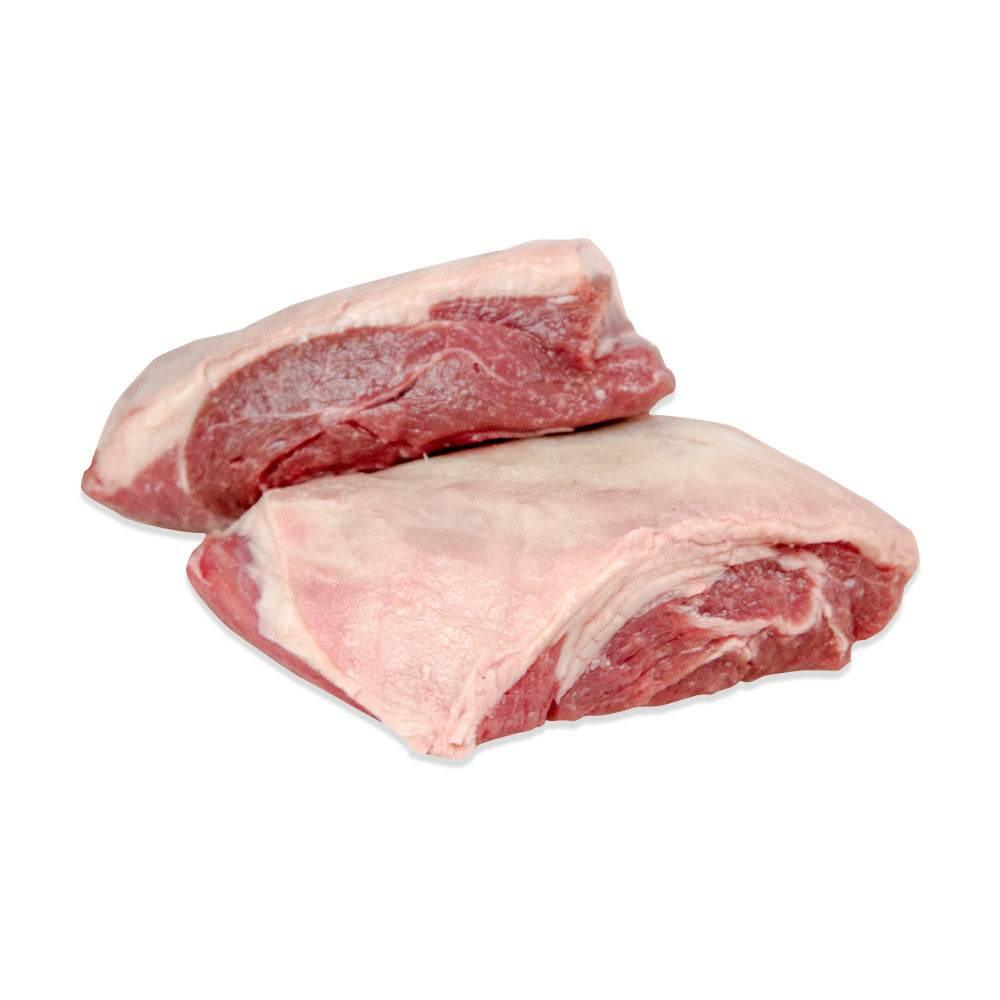 Two raw Merino lamb rump cuts with pink fat and red meat isolated on white background