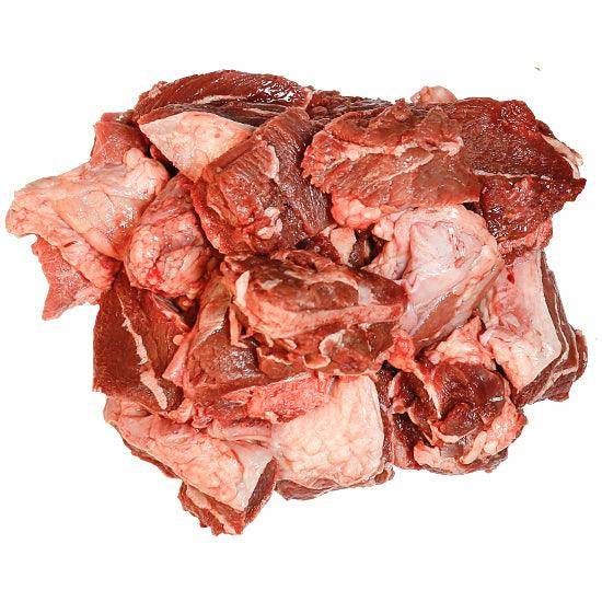 Raw chopped beef head meat with visible fat on white background