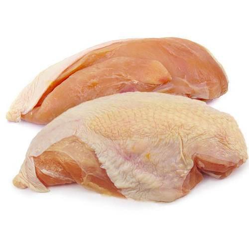 two raw chicken breasts, one with skin on and one skinless, isolated on white background