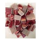 Raw goat meat chunks with fat, ready for cooking, on a white background