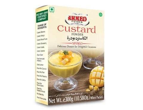 Ahmed Foods mango custard powder box with glass bowl of mango custard dessert and fresh mango cubes