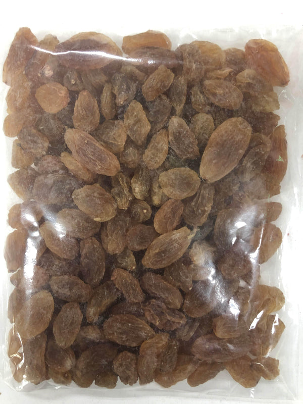 Clear plastic bag filled with dried brown raisins packed tightly