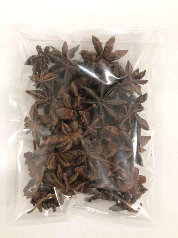 Vacuum-sealed clear plastic bag containing dried whole star anise spice