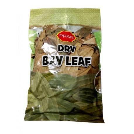 PRAN brand dry bay leaves in transparent sealed packaging with green and brown leaf images