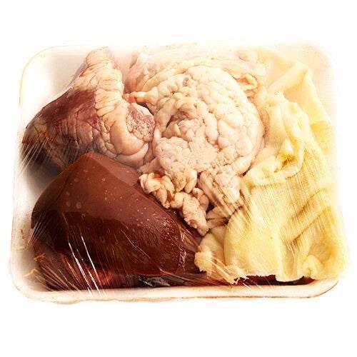 packaged raw beef offal including liver, tripe, and sweetbreads in foam tray wrapped with plastic