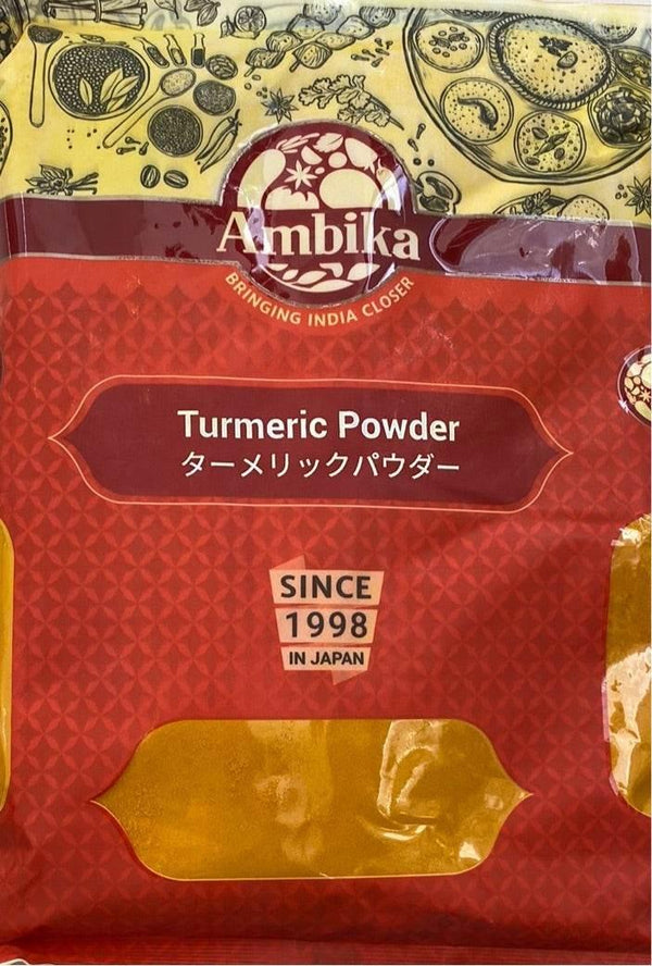 Ambika brand turmeric powder packaging with red and yellow design, Indian spices illustrations, labeled since 1998 in Japan