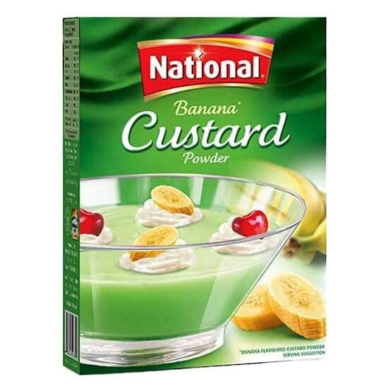 National Banana Custard Powder box with green custard dessert garnished with banana slices and cherries
