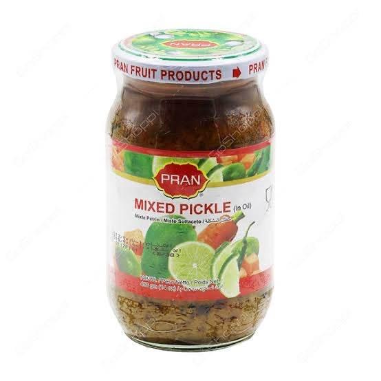 Jar of PRAN mixed pickle in oil with visible chili and lime on label