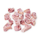 Frozen raw pork chews dog treats on white background