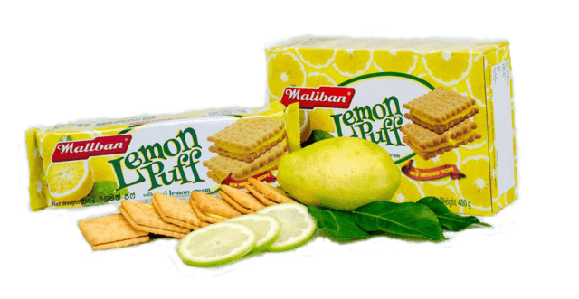 Maliban Lemon Puff biscuit packs with lemon slices, whole lemon, and green leaves on white background
