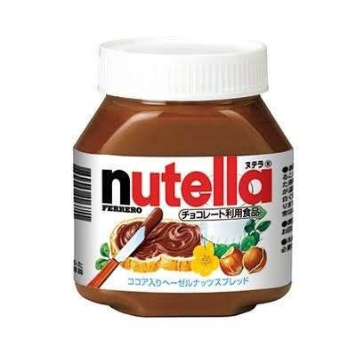 Jar of Nutella Ferrero chocolate hazelnut spread with wooden knife smeared with Nutella