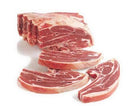 Fresh raw pork chops with marbled fat neatly arranged on white background