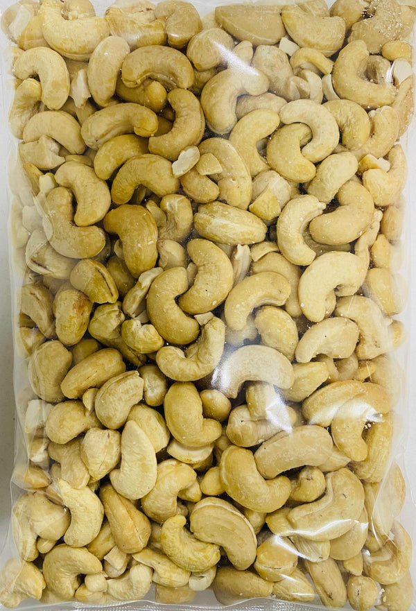 Clear plastic package filled with raw cashew nuts, natural and unroasted