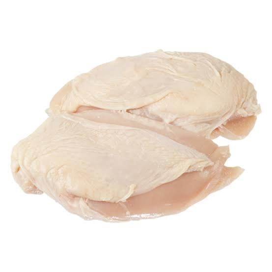Two raw chicken thighs with skin, isolated on white background, fresh poultry meat
