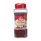 Badra brand red sumac spice in clear plastic container with red flip-top lid