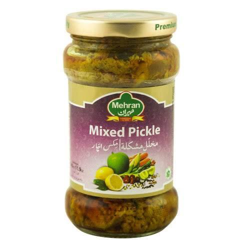 Mehran Mixed Pickle jar with a golden lid, featuring images of lemons and spices on the label
