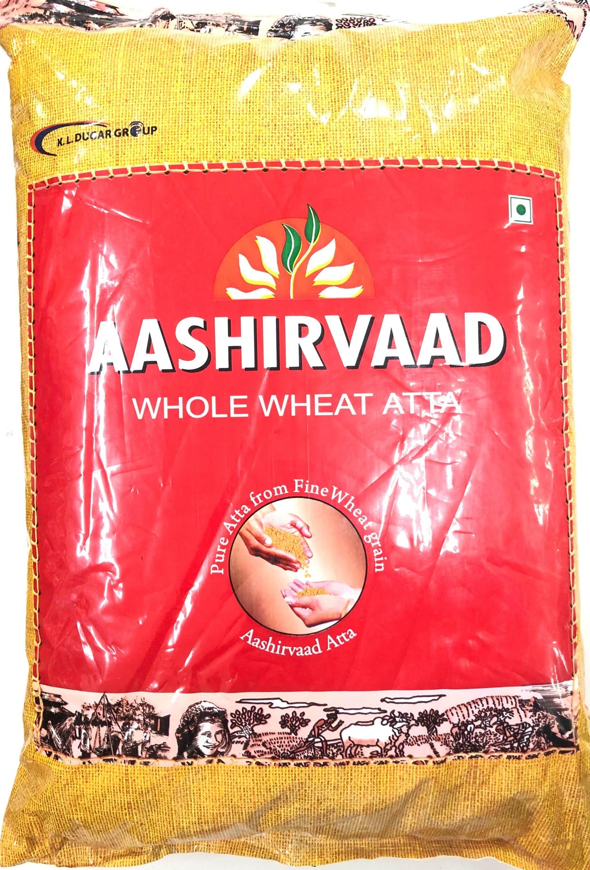 Aashirvaad whole wheat atta pack with red and yellow packaging featuring grain and hands illustration