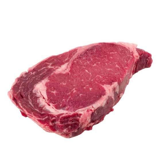 Fresh raw ribeye steak with marbling on white background