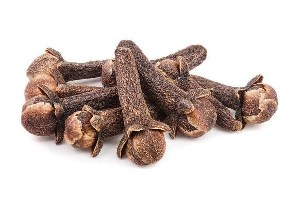 Close-up of dried whole cloves pile on white background, aromatic spice for cooking and baking