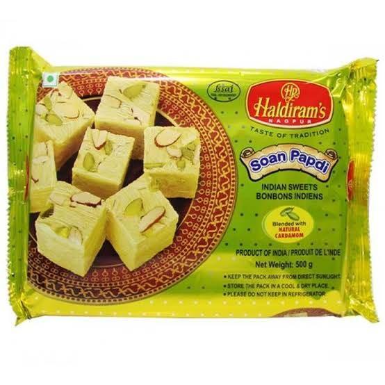 Haldiram's Soan Papdi Indian sweets packaged in 500g yellow plastic with traditional design and cardamom flavor