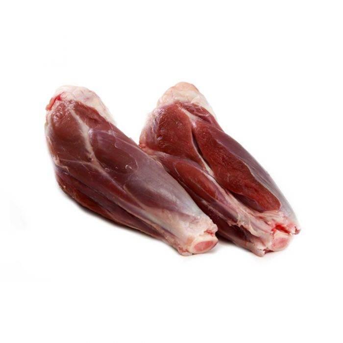 Two raw mutton shanks with bone, displayed on a white background